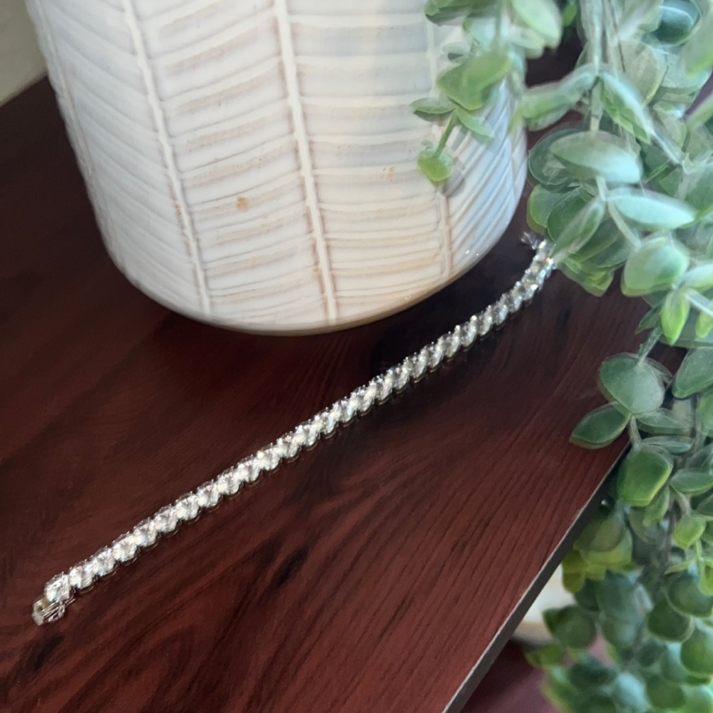 Sterling Silver Lab created sapphire tennis bracelet.